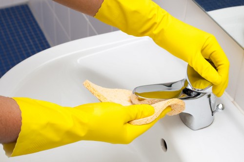 Cleaner wearing PPE while inspecting a property for safety